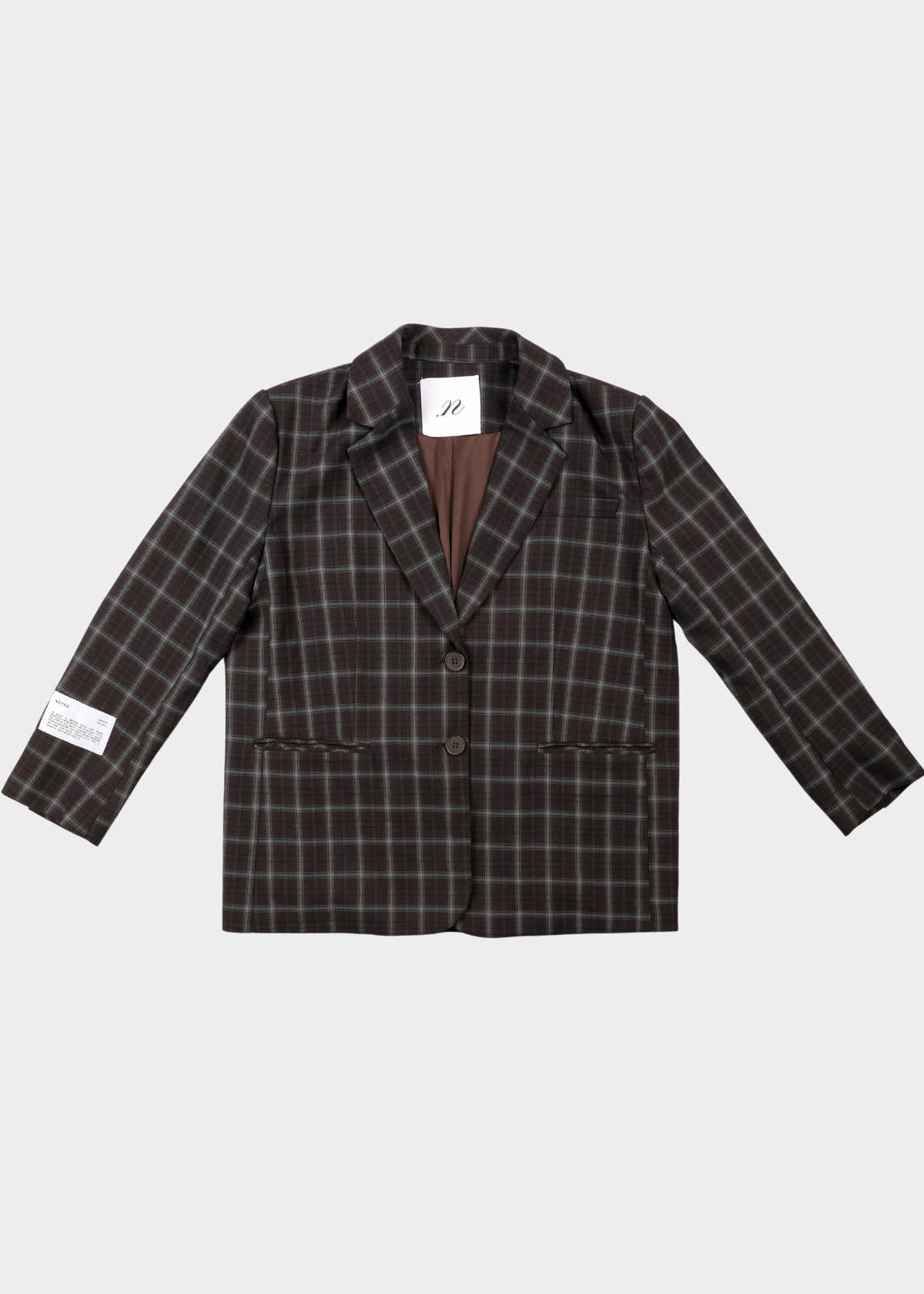 NOTED Antwerp, Carli blazer checkered. dark brown and black plaid blazer jacket with a brown lining, displayed flat against a light gray background.
