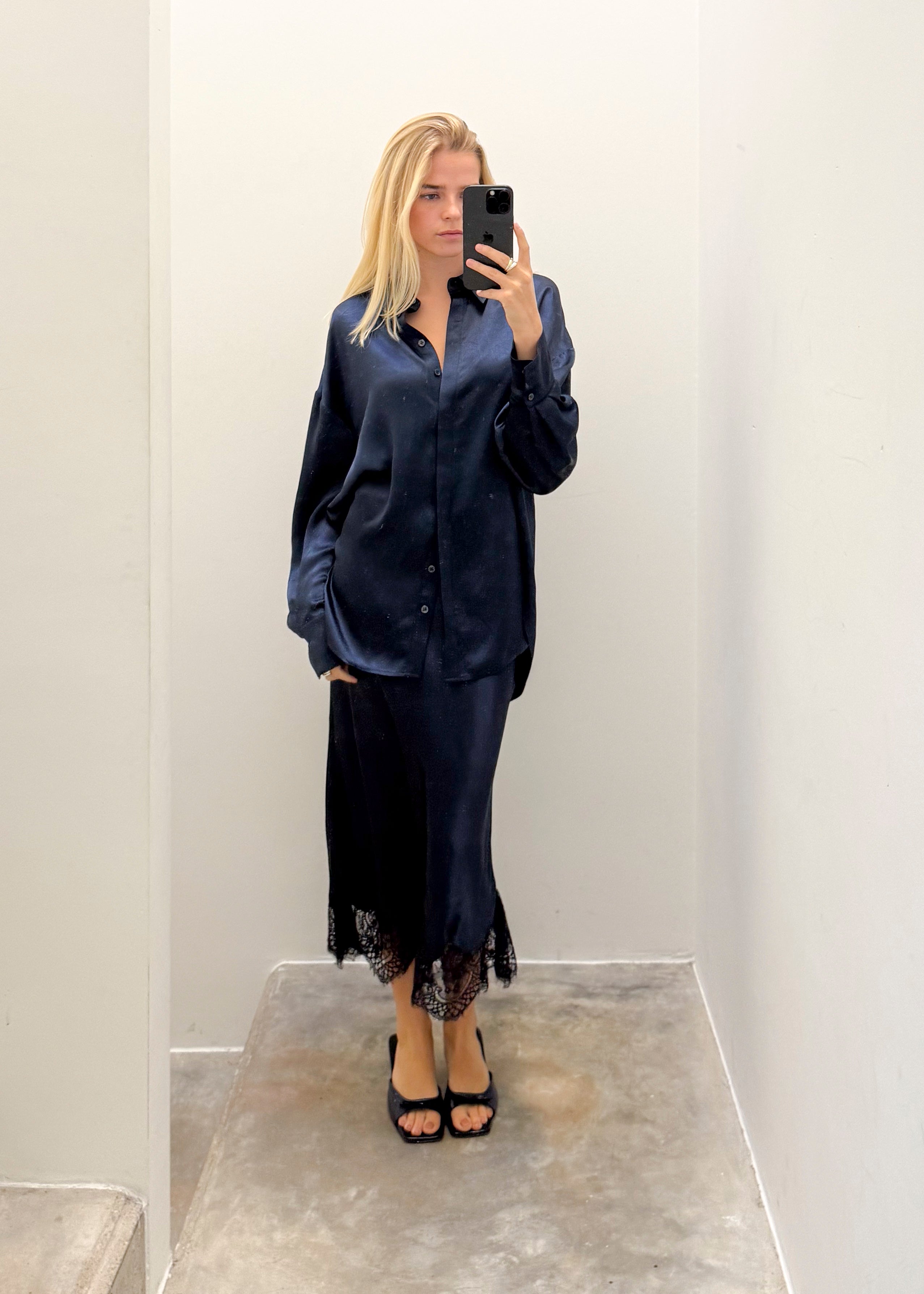 Sating navy skirt with lace detailing on bottom by Noted Antwerp.