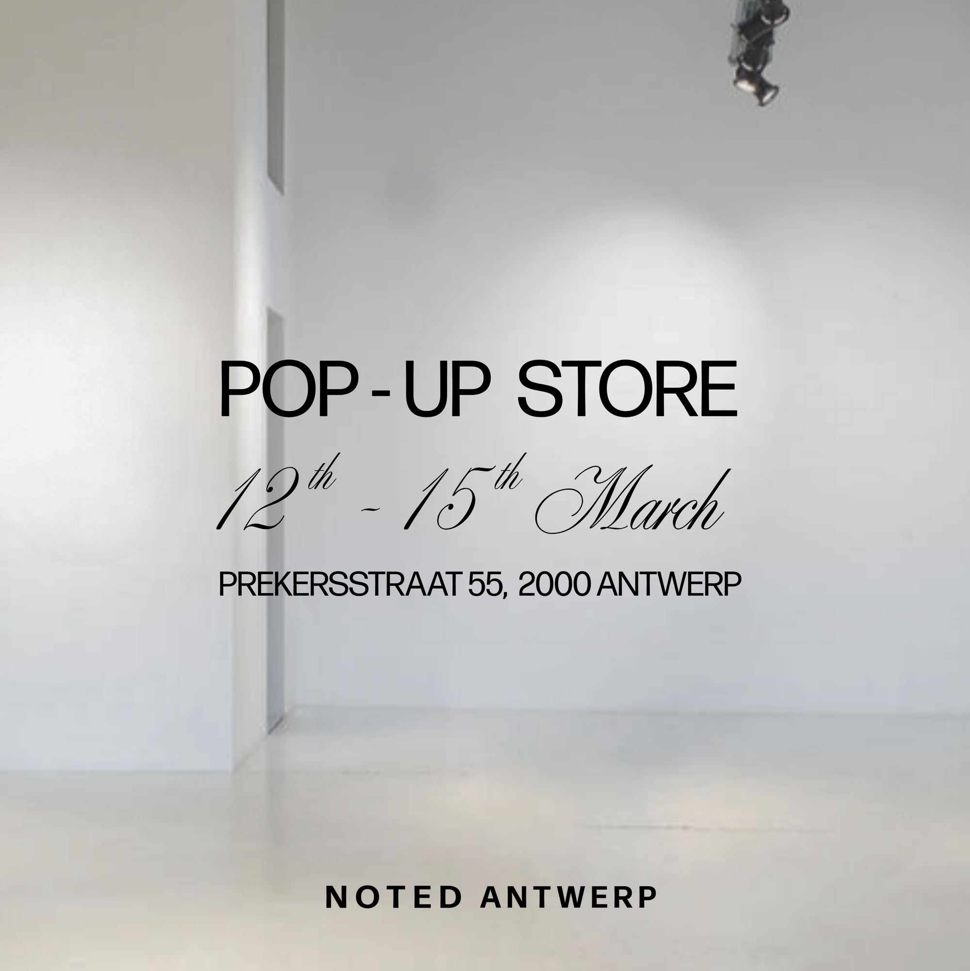 Advertisement for a pop-up store event with text on a white wall.