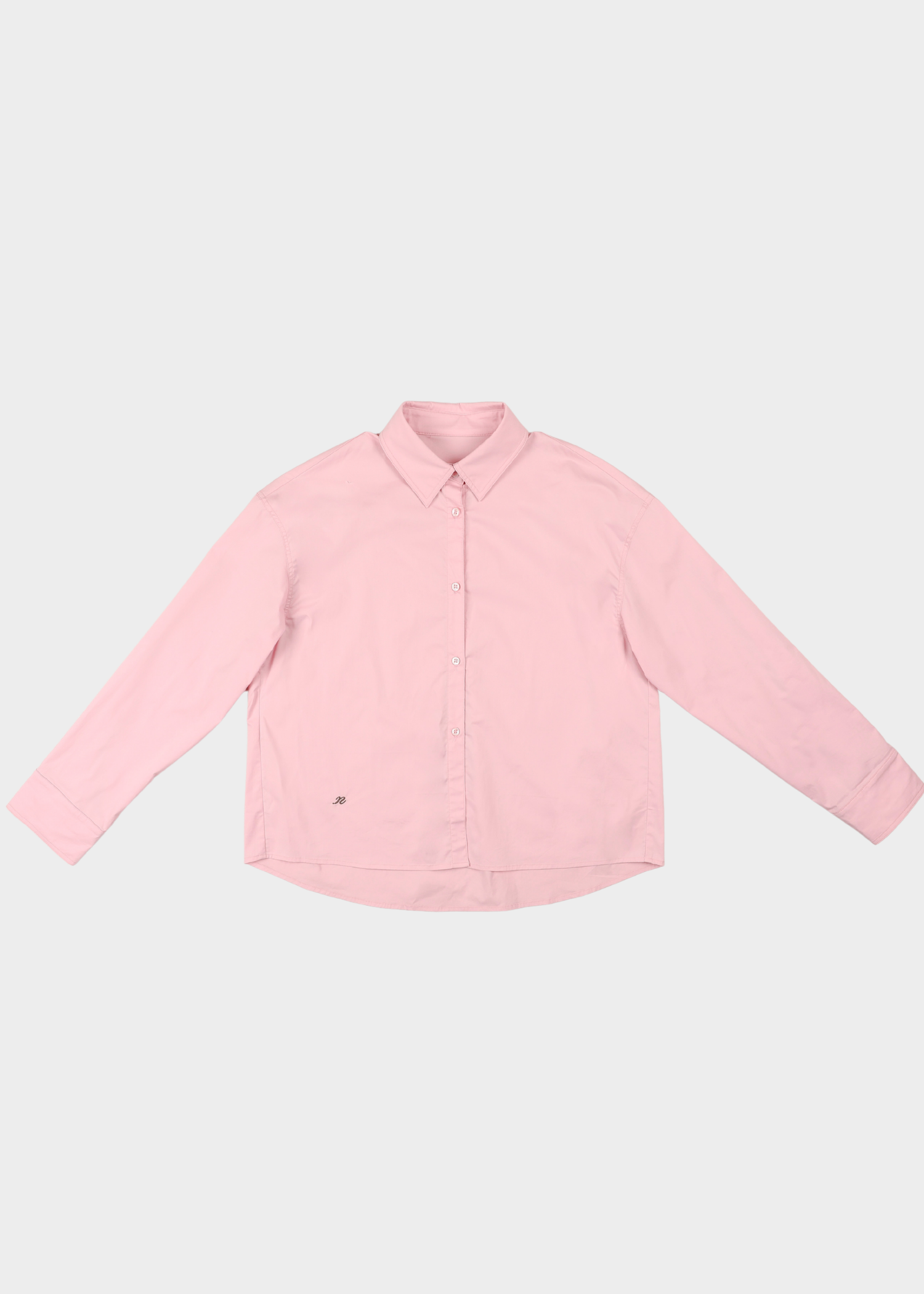 Noted Antwerp anni pink shirt. A light pink long-sleeve button-up shirt with a pointed collar, laid flat against a light gray background.